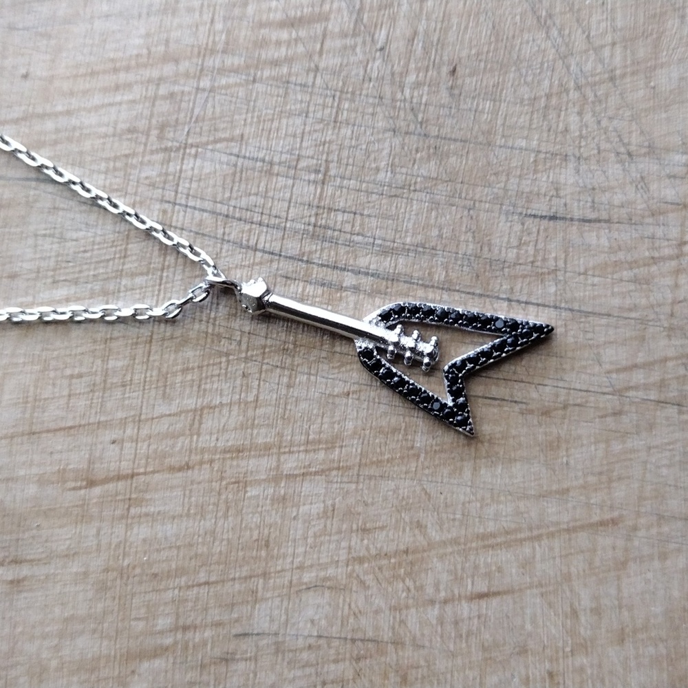 White gold and diamond V Guitar necklace